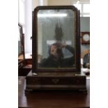 A late 18th Century mahogany toilet mirror with concave drawers to front on ogee feet and original