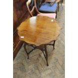 An Edwardian mahogany shaped top occasional table