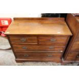 An Edwardian satin walnut chest of two short and two long drawers