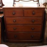 A late Victorian round cornered chest of two over three drawers