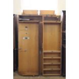 A 1920's oak gent's wardrobe by Compactum with glazed interior compartments etc, width 129cm approx.