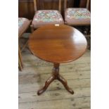 A mid 19th Century tripod tilt top table