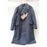 A post WWII (1960) R.A.F. overcoat with a Red Cross Proficiency medal