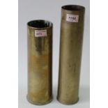 A WWI era French 75mm brass shell case with a 1917 dated British 18 pdr shell case