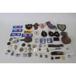 A mixed box of mainly badges and insignia etc