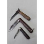 Two pocket knives with a combination knife/cartridge extractor,