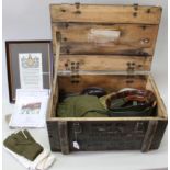 A wooden ammo crate containing mixed militaria including a WWI memorial scroll,