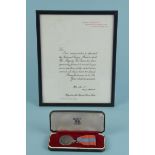 A cased Imperial Service medal to a Walter Smith, complete with its scroll,