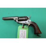 An unusual conversion of a Colt pocket revolver to 'cartridge' use,