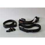 Three black leather 'gun belts'