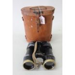 A pair of binoculars WWII era No.5 Mk III with correct 1944 leather case