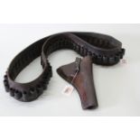 An early 20th Century leather holster with cleaning rod,