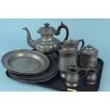 A selection of antique pewter including six 18th Century pewter plates, two 19th Century measures,