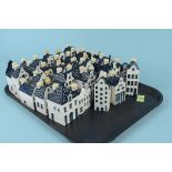 Approx thirty five Bols for KLM Blue Delft spirit miniature houses (contents not fit for
