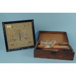 An antique veneered sewing box and contents plus a framed antique small sampler