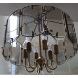 A large circular six lamp electrolier light fitting, brass finish and glass panels,