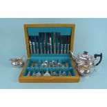 A canteen of plated cutlery (approx forty seven pieces) plus a plated three piece tea set