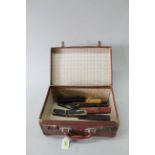 Seven vintage cased cut throat razors (signs of age and wear to boxes) plus a small brown leather