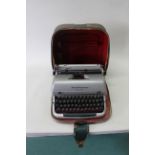 A vintage cased Remington 'Quiet-Riter' typewriter