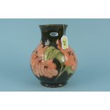 A large Moorcroft Hibiscus pattern vase,