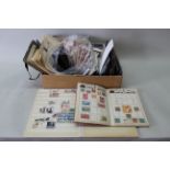 A selection of first day covers and presentation pack stamps, some collectors coins,