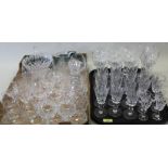 A quantity of drinking glasses including sets of wine, champagne, sherry and brandy plus a decanter,