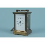 A brass carriage clock of small proportions by Matthew Norman,