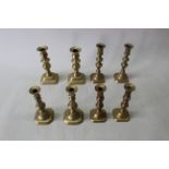 Four pairs of Victorian brass candlesticks