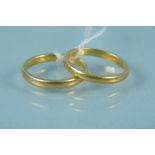 Two 22ct gold band rings,