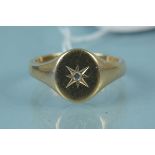 A large gents 9ct gold signet ring set with a single diamond in star cut setting, size Z,