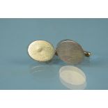 A pair of yellow metal oval cufflinks stamped 14K, weight approx 8.