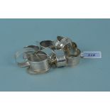 Nine various silver napkin rings, some with engraved decoration,