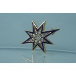 An unmarked yellow metal blue enamel and diamond star form brooch,