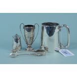 A silver mug, silver tongs, miniature silver trophy plus a silver salt,