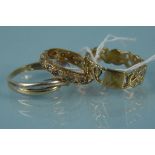 Three 9ct gold rings of various designs,