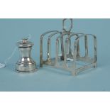 A silver toast rack plus a miniature silver pepper grinder