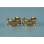A pair of 9ct gold textured design hoop earrings, weight approx 2.