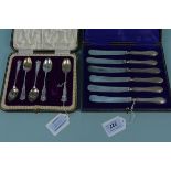 Five (of six) silver teaspoons in box together with a cased set of six silver handled butter knives