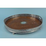 A large oak and silver plated gallery tray on four bun feet with central Victorian silver panel to