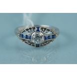 An Art Deco style platinum diamond and sapphire set ring,