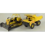 Vintage Tonka trucks including a front loader and road grader (both as found with rust),