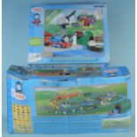 Two boxed Thomas the Tank Engine sets, Motor, Roads and Rails and Thomas and Cranky Deluxe Action