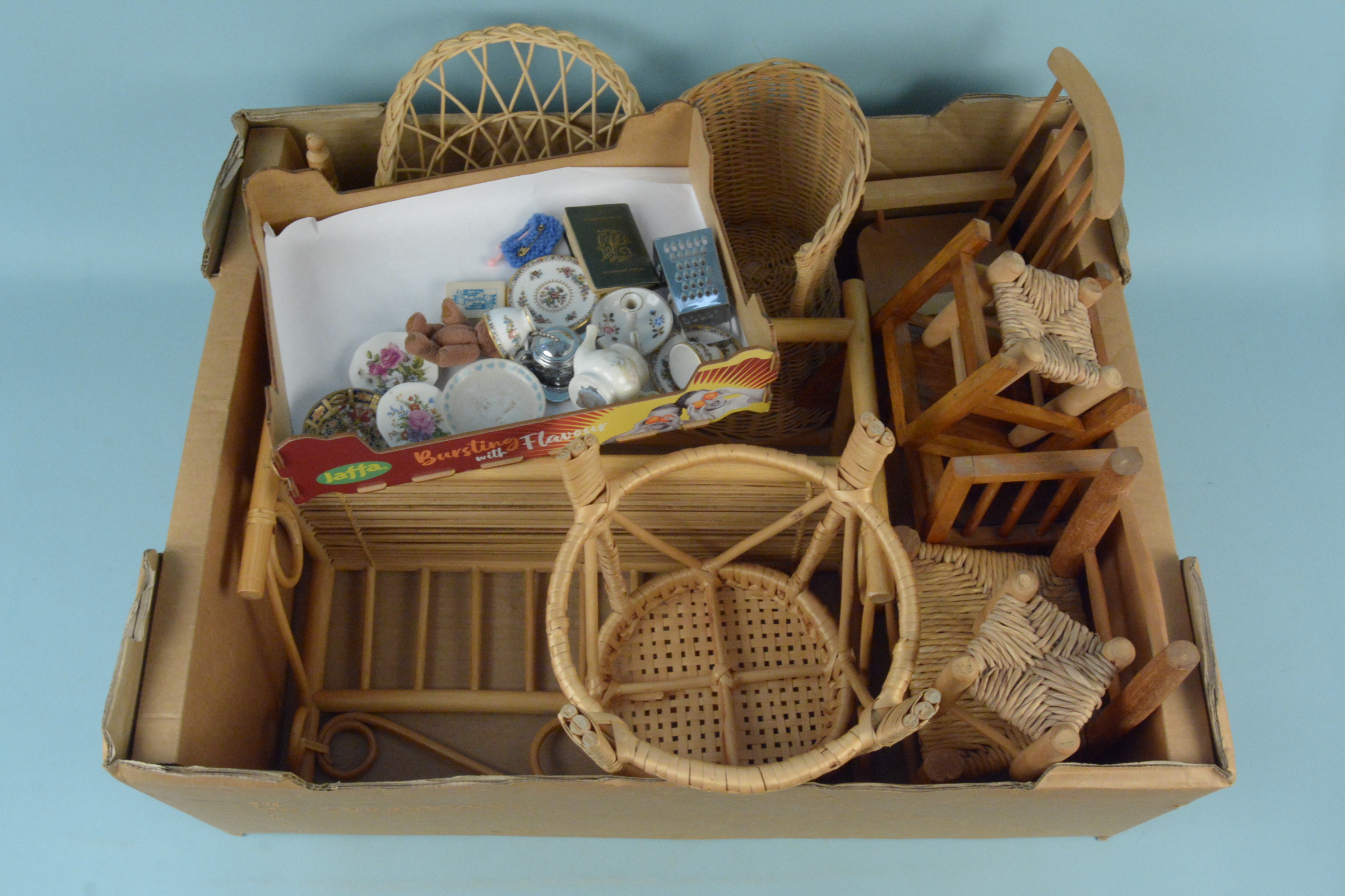 Various sized dolls house bamboo and cane furniture plus a pair of Coalport miniature cups and