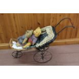 A vintage Victorian style child's toy pram together with two vintage Teddy bears