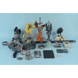 A selection of fantasy figurines including a dragon head walking cane,
