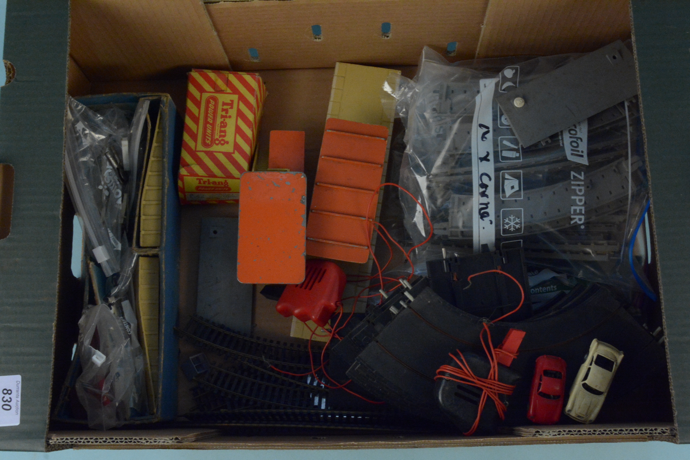 A box of Hornby and Triang train accessories including station buildings,