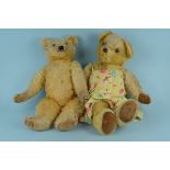 A large Merrythought straw stuffed bear with jointed limbs,