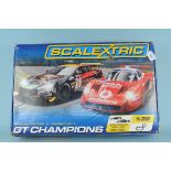 A boxed Scalextric Gt Champions, Aston Martin DBR9 V Maserati MC12,