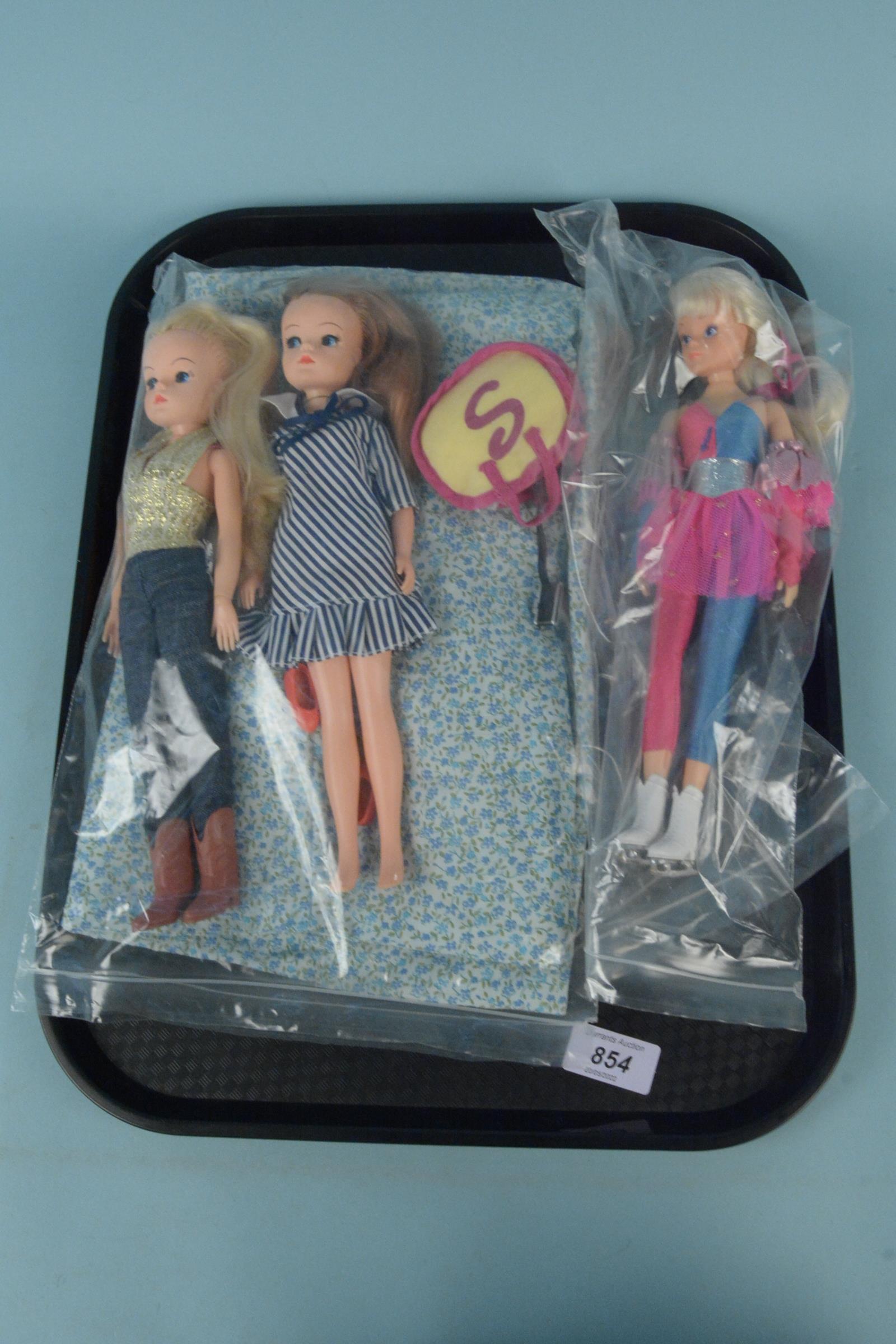 Three vintage Sindy dolls, one ice skater,