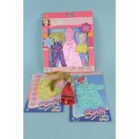 A 1970's Pippa doll together with unopened Barbie clothes in packet and two Sindy City Girl outfits